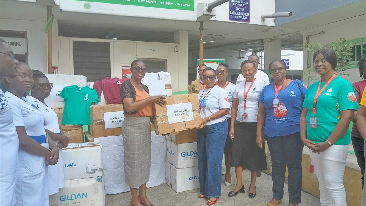 NBS and hospital representatives hand over a box of donated T-shirts at Princess Marie Louise Children’s Hospital.